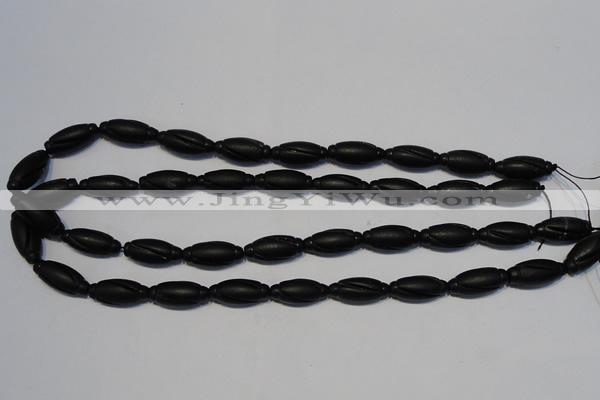 CNE15 15.5 inches 9*20mm carved rice black stone needle beads wholesale